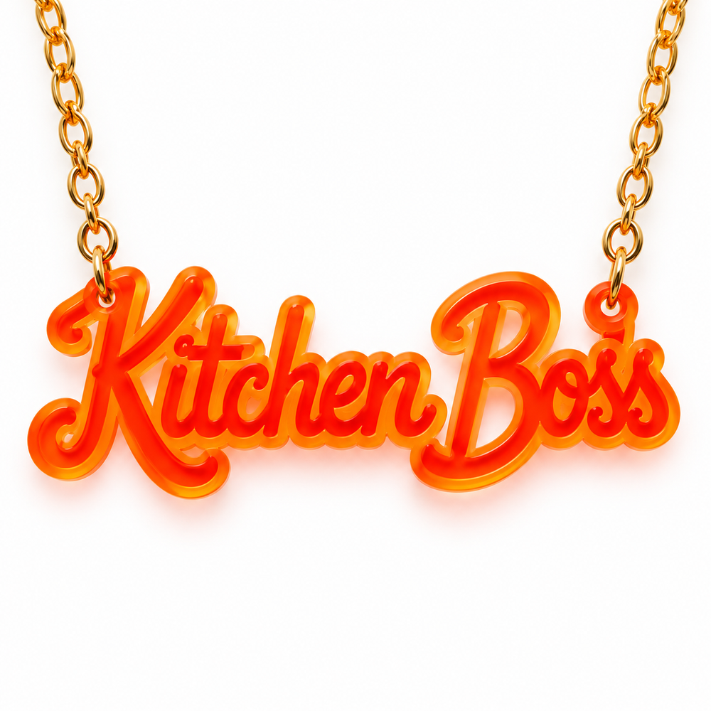 Kitchen Boss acrylic necklace in orange on a gold chain