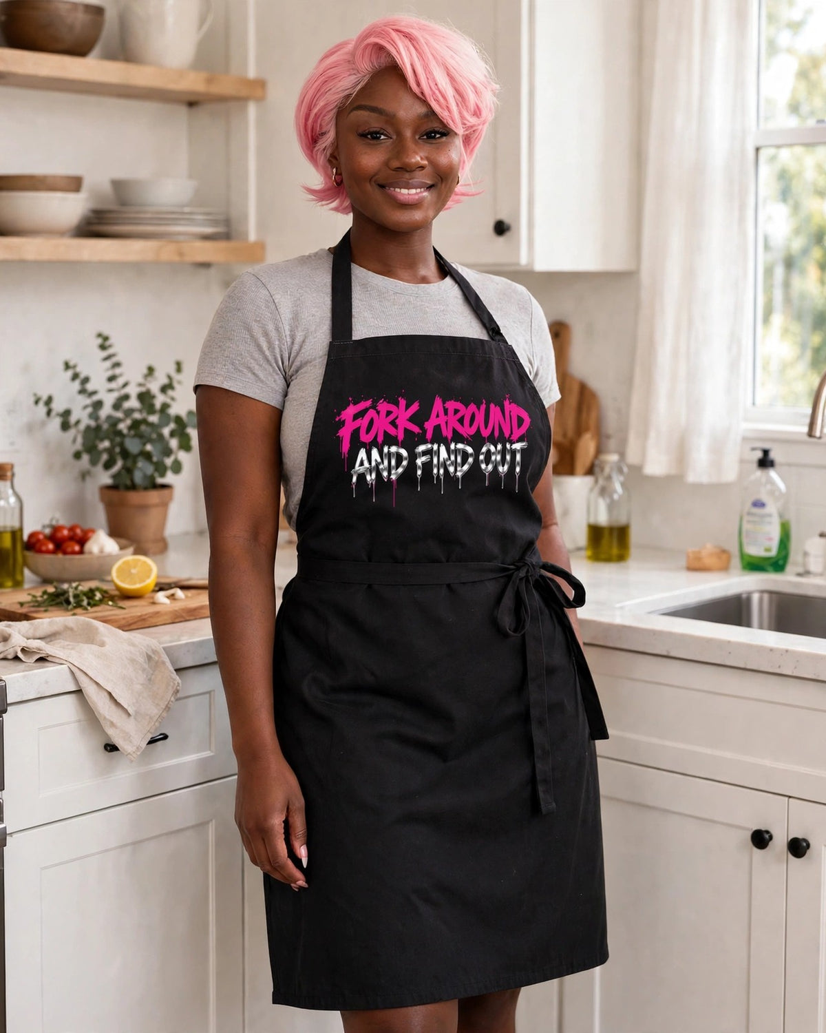 Woman wearing the Fork Around And Find Out black apron in her kitchen